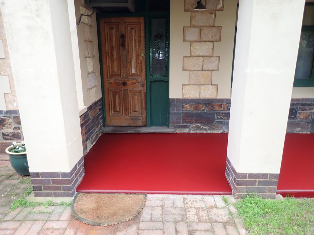 Concrete resurfacing, heritage red, old verandah new again