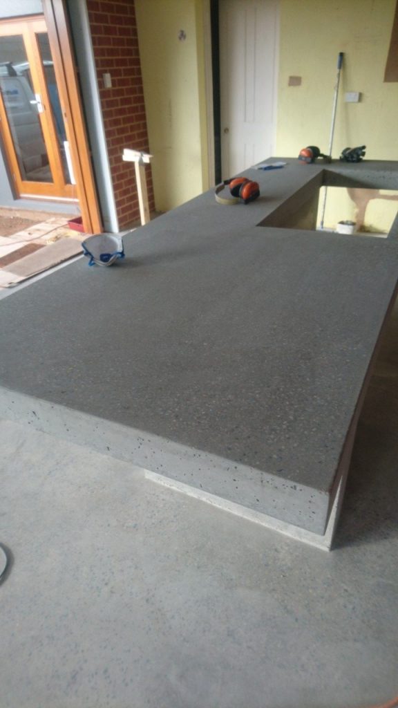 Benchtop surfacing: exposing aggregate