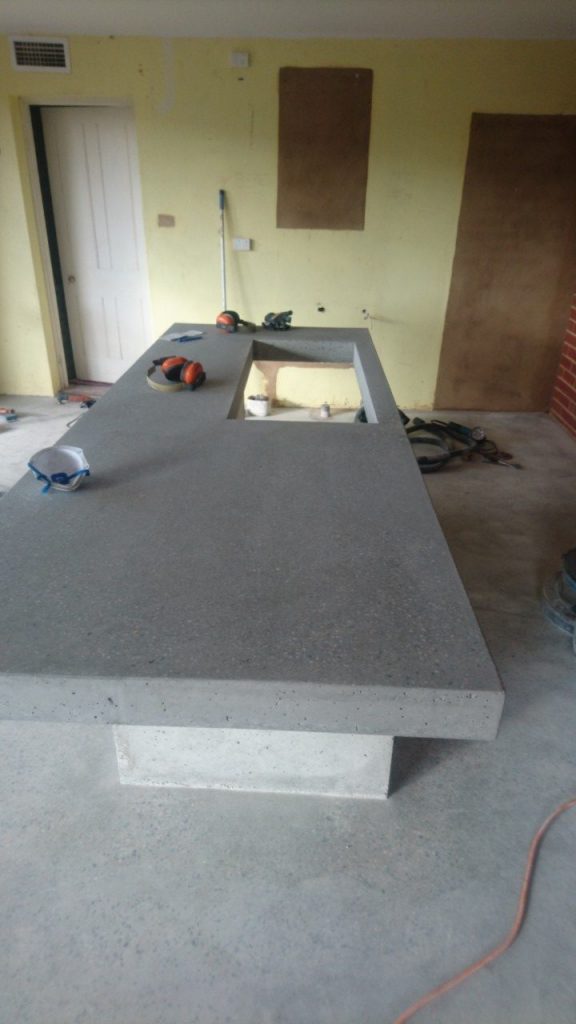 Benchtop surfacing: exposing the aggregate