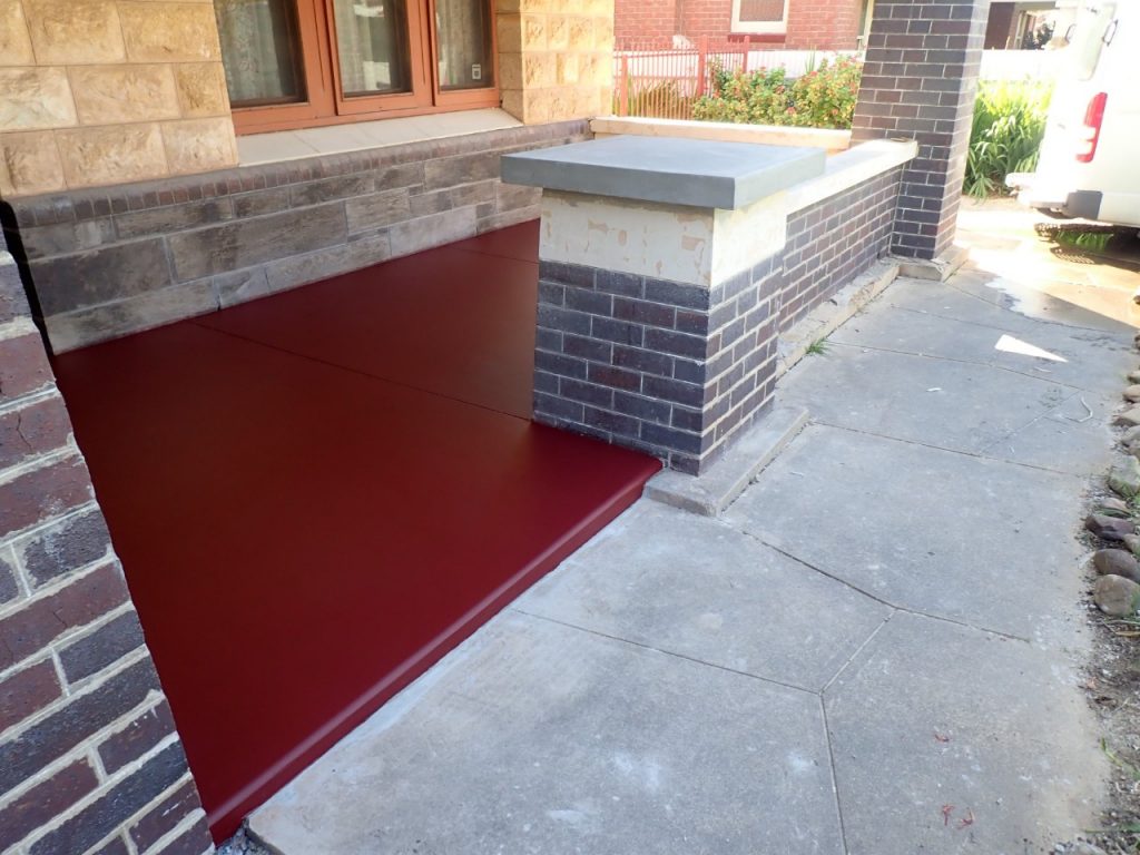 Concrete resurfacing, new red verandah, after