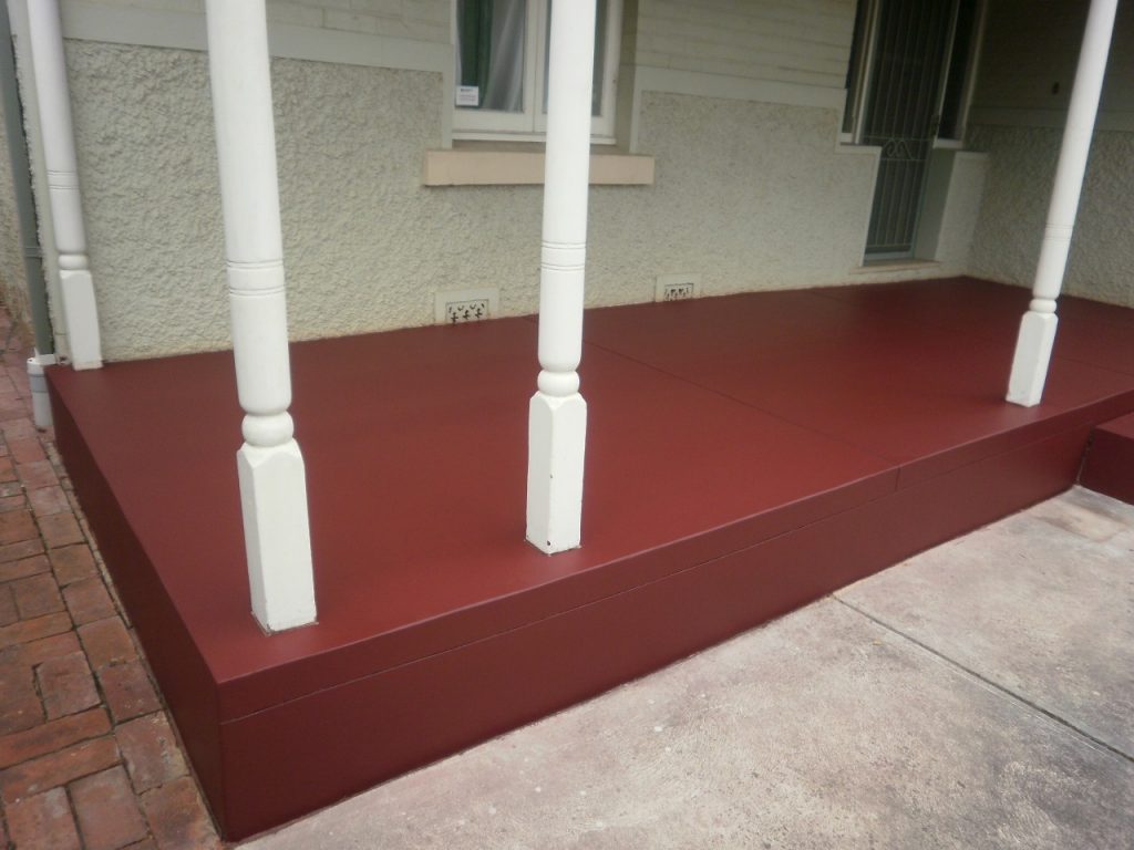 Concrete resurfacing, red verandah restored
