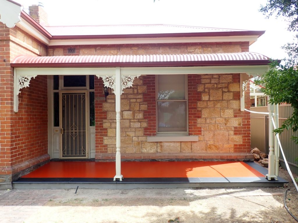 Concrete resurfacing, two tone red verandah with slate bullnose