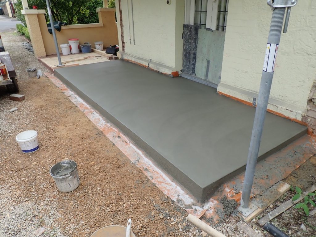 Concrete resurfacing, walls removed, new concrete verandah floor