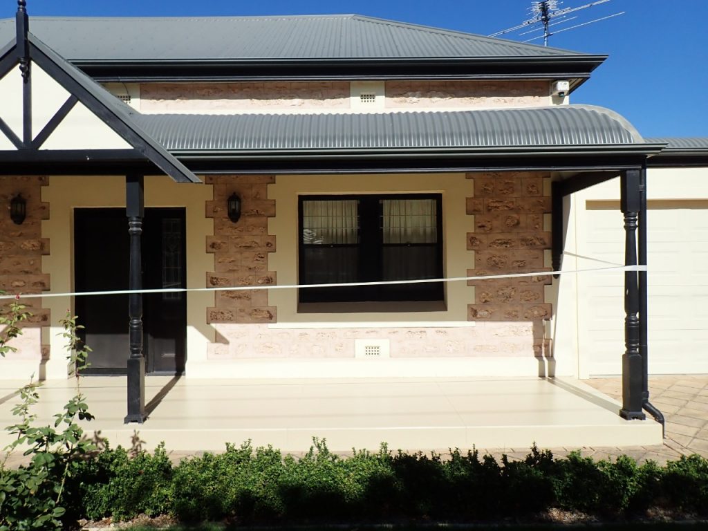 Concrete resurfacing, worn out verandah, painted ceam