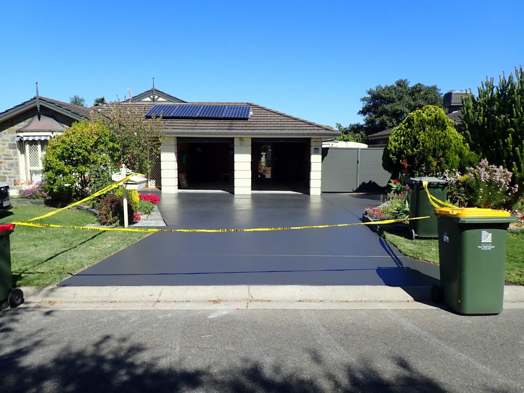concrete resurfacing, charcoal painted driveway