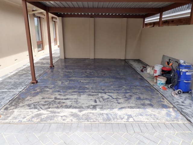 Concrete resurfacing. Worn painted concrete carport: Before