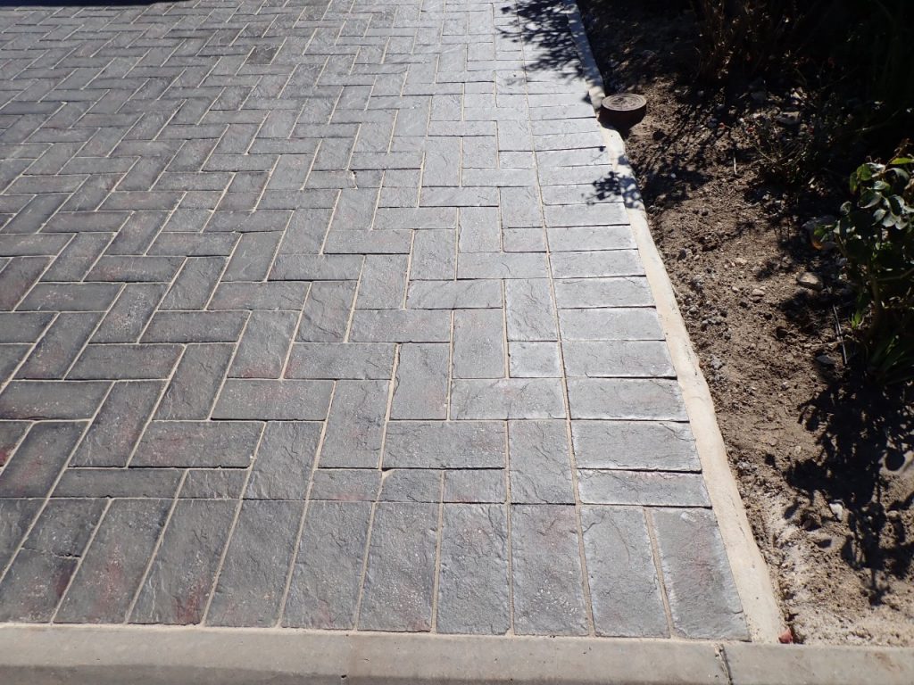 resurfacing pavers, sealed and concrete haunching installed