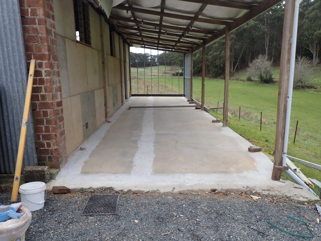 Barn to office conversion: uneven concrete floor - before