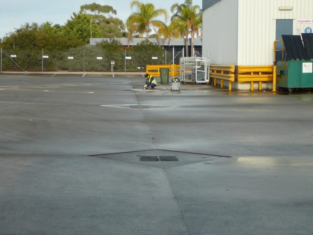 Concrete reparis: storm water grate - after