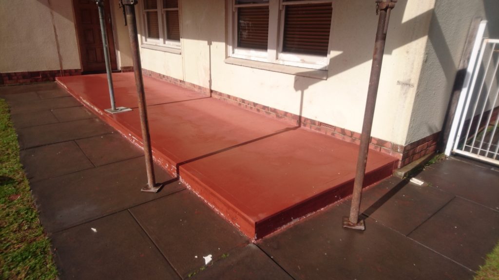 New red coloured concrete verandah